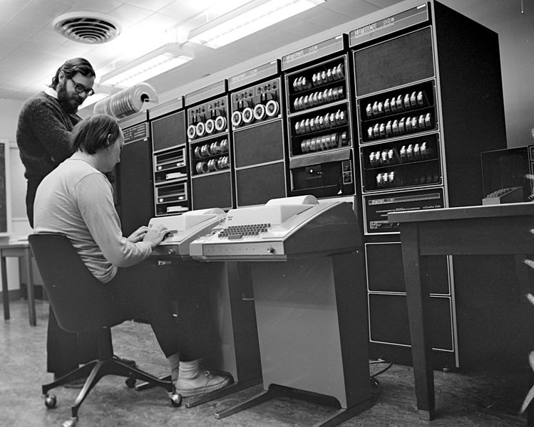 749px Ken Thompson sitting and Dennis Ritchie at PDP 11